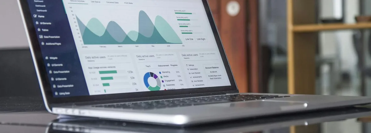 Business analytics dashboard on a laptop used for B2B website strategy planning