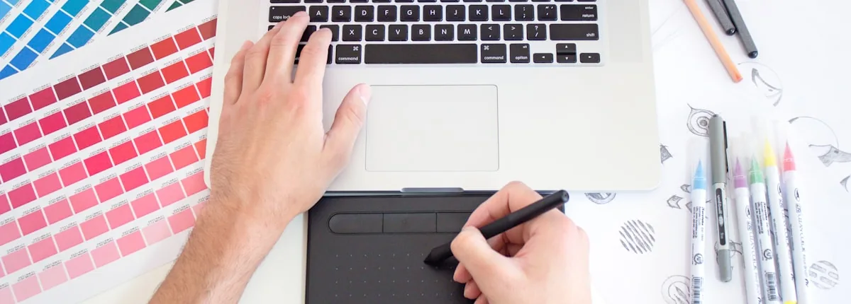 Designer workspace with sketches and tools for custom logo design